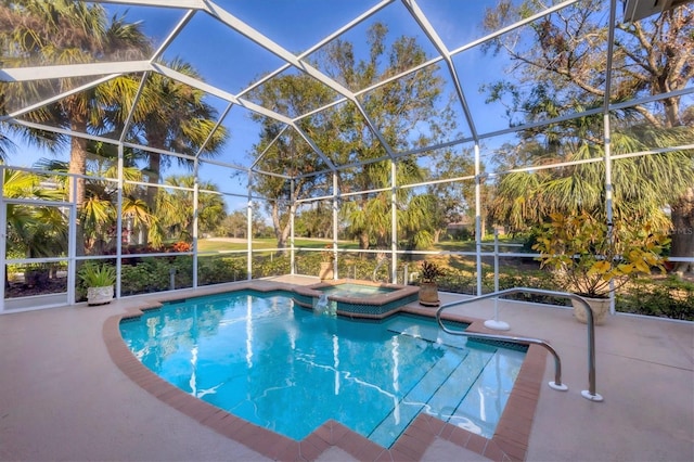 view of swimming pool with an in ground hot tub, glass enclosure, and a patio area