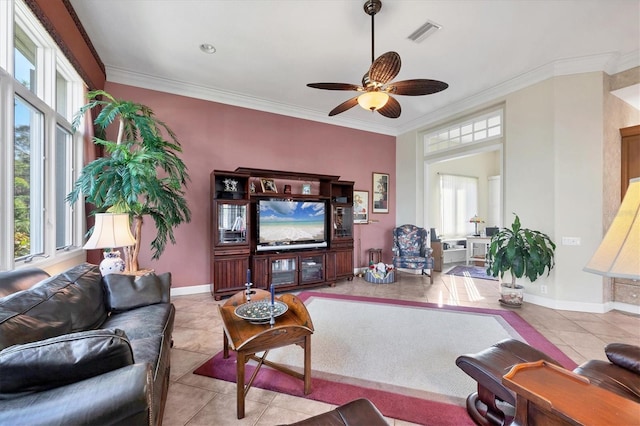 tiled living room with crown molding and ceiling fan