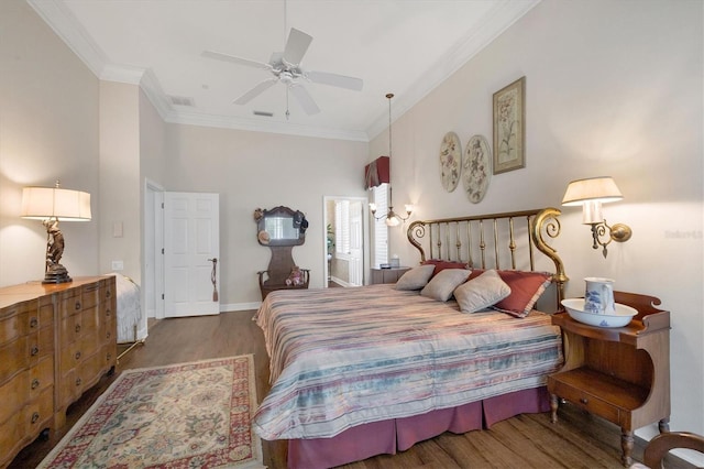 bedroom with ceiling fan, ornamental molding, and dark hardwood / wood-style floors