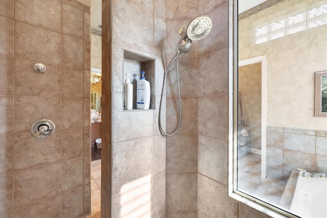 bathroom featuring a tile shower