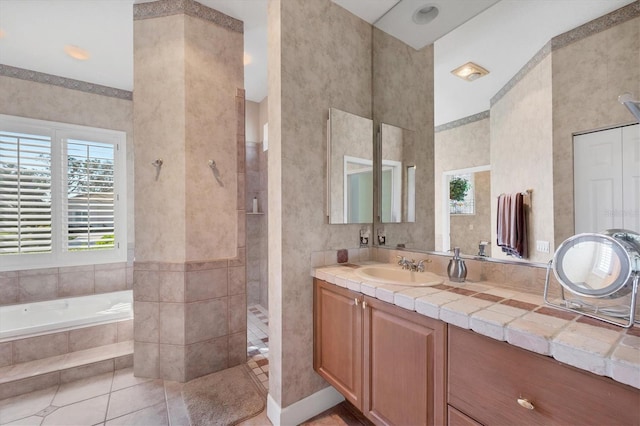 bathroom featuring vanity, tile patterned flooring, and plus walk in shower