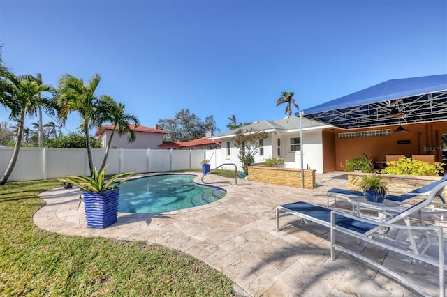 view of swimming pool with a patio area