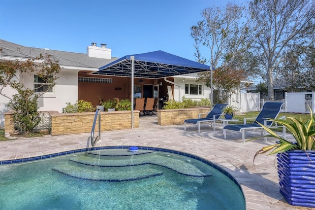 view of swimming pool featuring a patio area