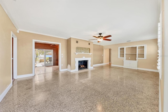 unfurnished living room with ceiling fan and ornamental molding