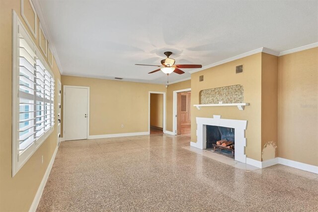 unfurnished living room featuring ceiling fan and ornamental molding