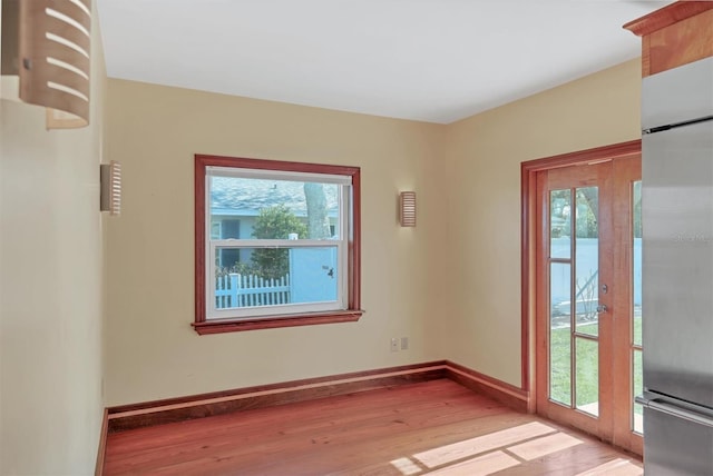 interior space featuring french doors and light hardwood / wood-style flooring