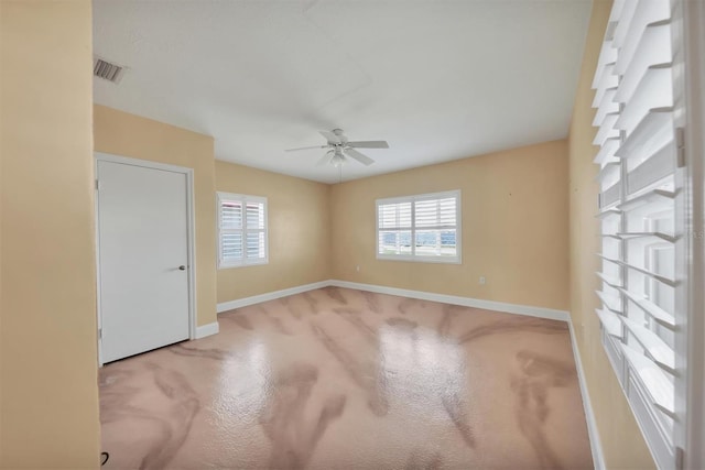 spare room with ceiling fan