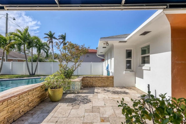 view of patio featuring a fenced in pool