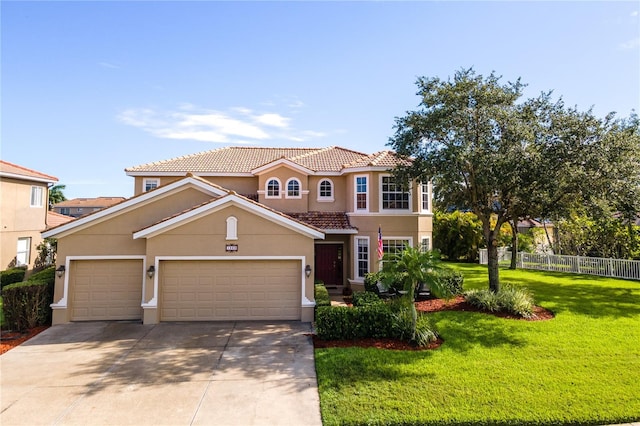 mediterranean / spanish home featuring a front yard