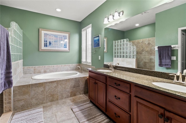 bathroom featuring tile patterned floors, vanity, and independent shower and bath