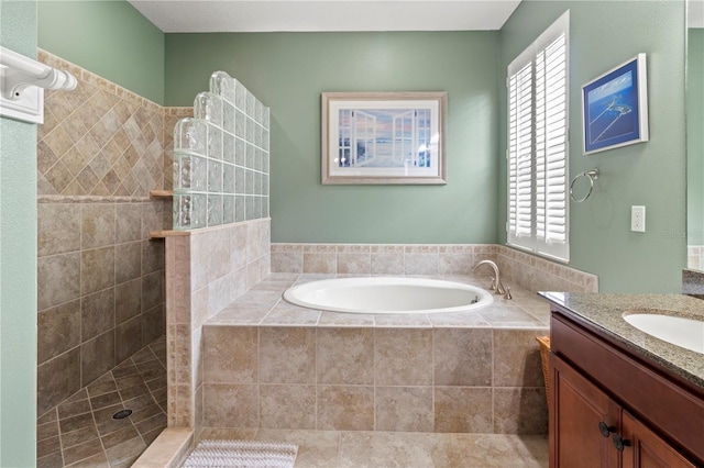 bathroom featuring vanity and separate shower and tub