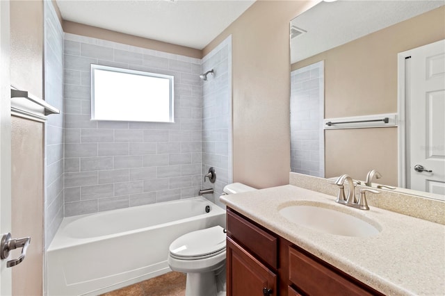 full bathroom with toilet, vanity, tile patterned floors, and shower / washtub combination