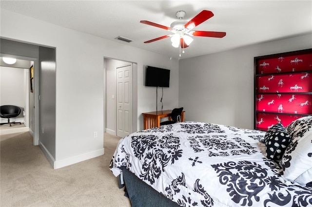 carpeted bedroom with ceiling fan