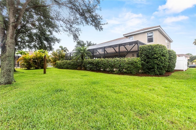 view of yard featuring a lanai