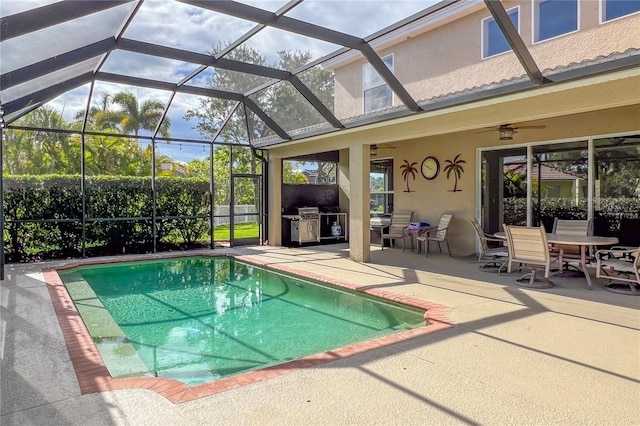 view of swimming pool featuring a lanai, ceiling fan, a patio area, and grilling area