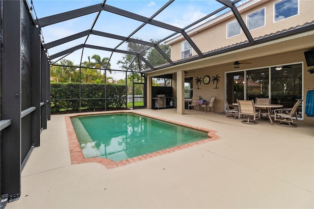 view of pool featuring ceiling fan, a lanai, and a patio