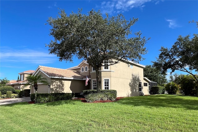 view of side of property with a yard