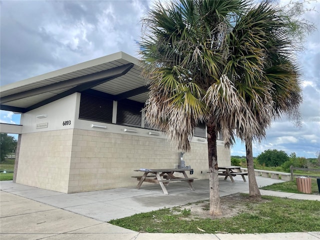 surrounding community with a patio area