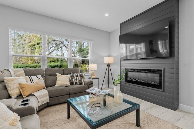 living room featuring a fireplace