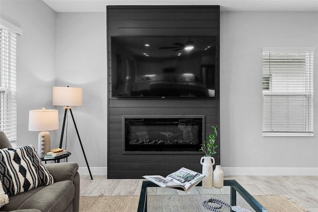 living room featuring a large fireplace