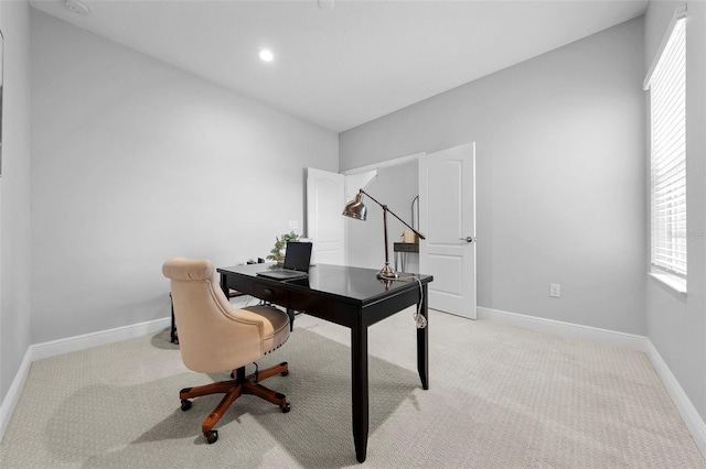 carpeted office space featuring plenty of natural light