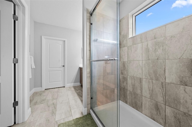 bathroom featuring an enclosed shower and vanity