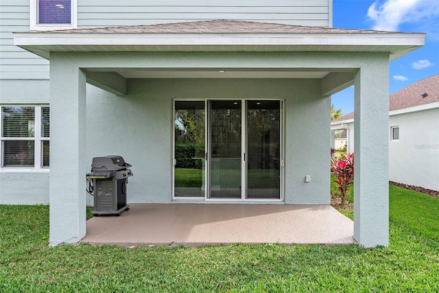 exterior space featuring a lawn and a patio