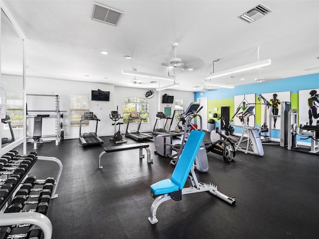 exercise room with a textured ceiling