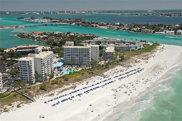 drone / aerial view with a water view and a view of the beach