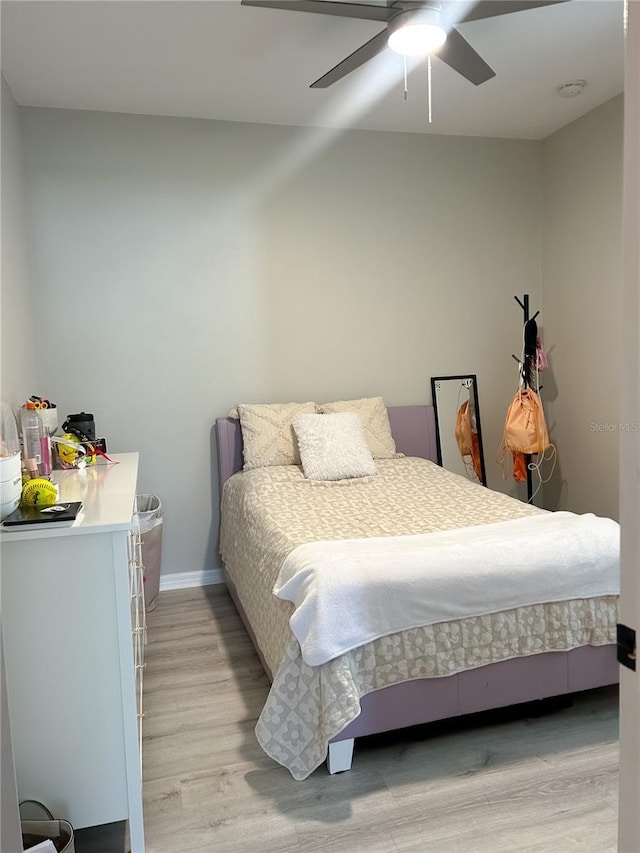 bedroom featuring ceiling fan and light hardwood / wood-style floors