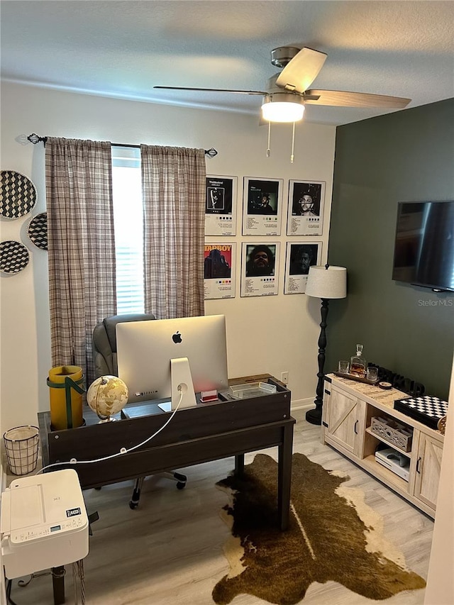 misc room featuring ceiling fan and light hardwood / wood-style floors