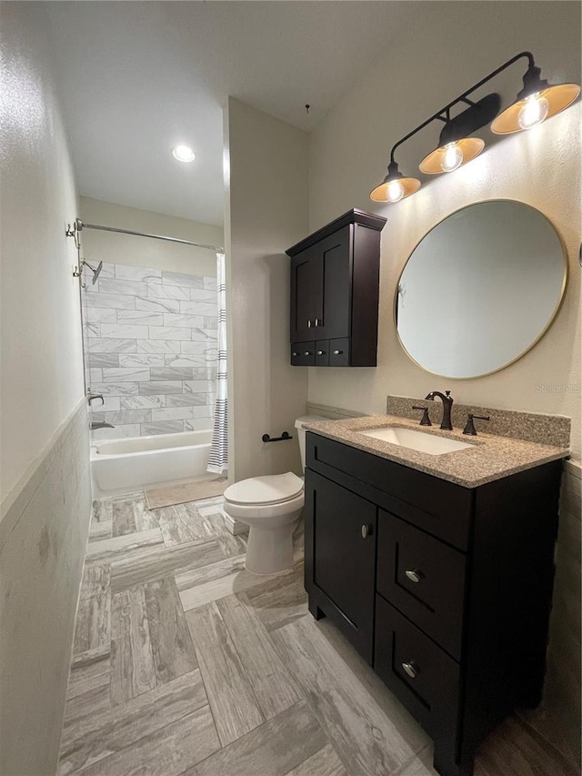 full bathroom featuring toilet, shower / tub combo, and vanity