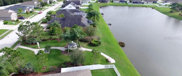 birds eye view of property with a water view