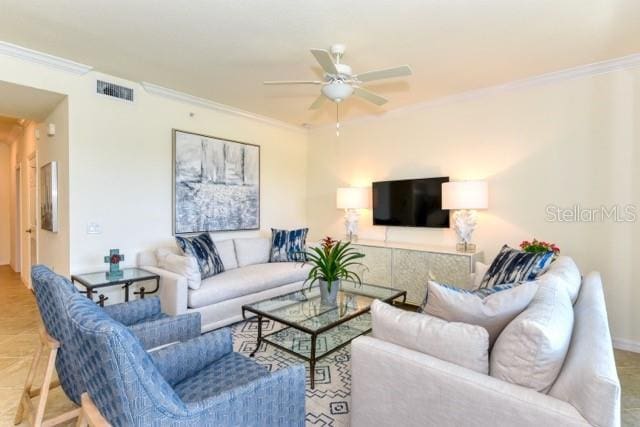 living room featuring ceiling fan, crown molding, and light parquet flooring