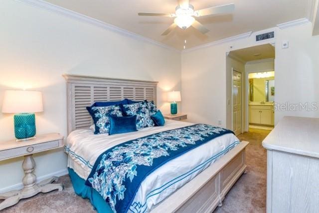 bedroom featuring ornamental molding, ceiling fan, light carpet, and connected bathroom