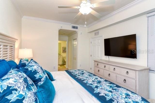 bedroom with ensuite bath, ceiling fan, and ornamental molding