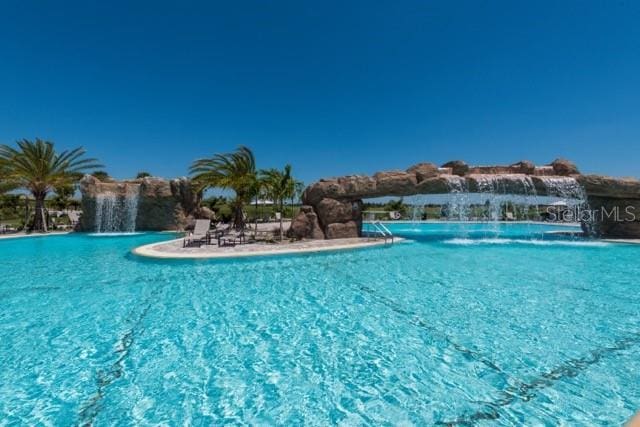 view of pool featuring pool water feature