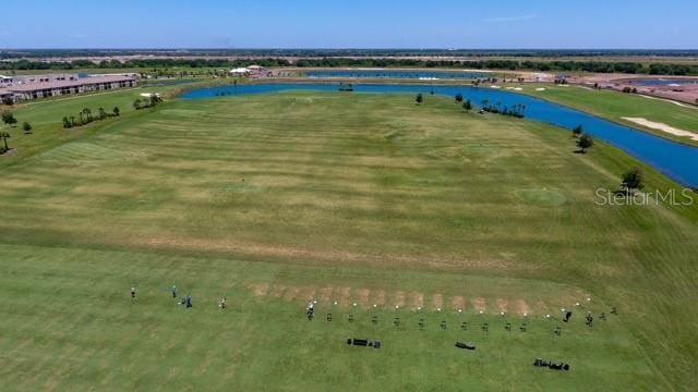 birds eye view of property featuring a water view and a rural view