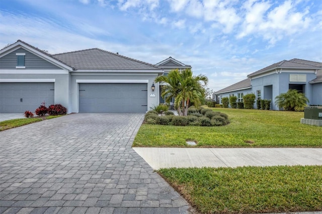 single story home with a front yard and a garage