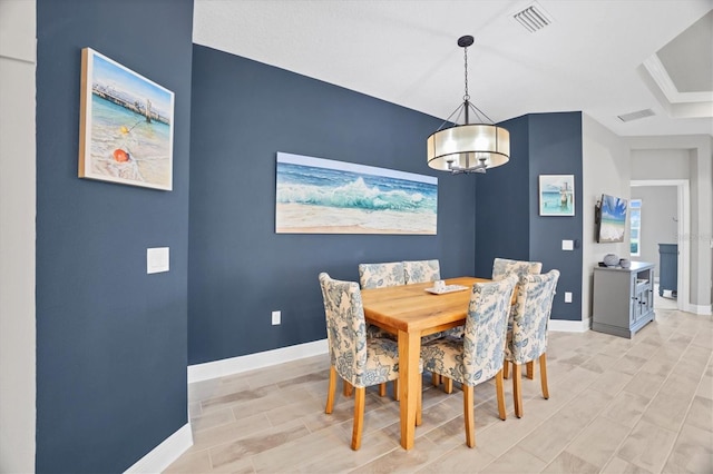 dining area with a chandelier