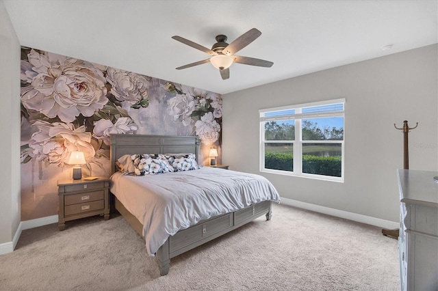 bedroom with ceiling fan and light carpet