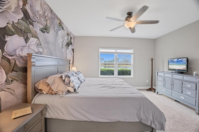 bedroom with light colored carpet and ceiling fan