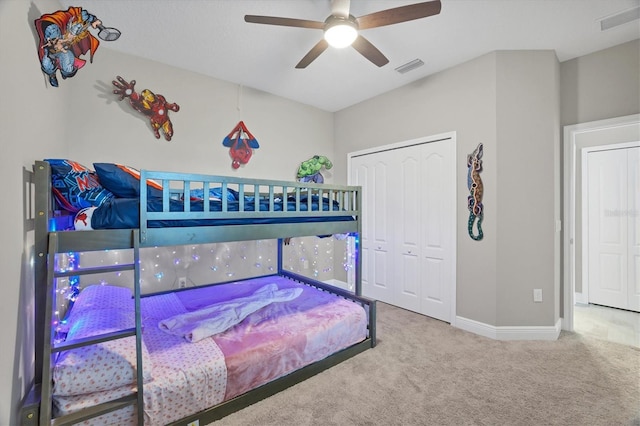 bedroom featuring carpet flooring, ceiling fan, and a closet