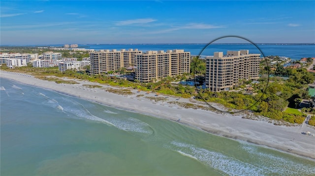 bird's eye view with a beach view and a water view