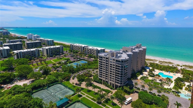 bird's eye view featuring a water view and a view of the beach