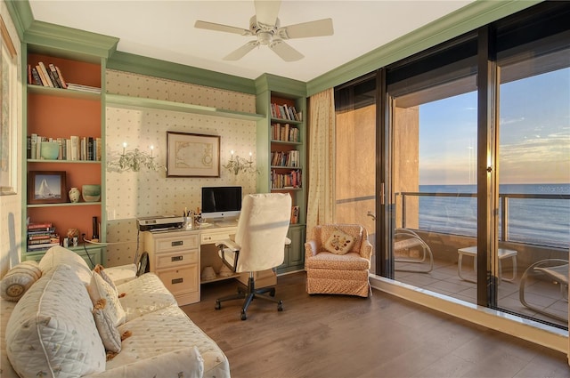 home office featuring ceiling fan, dark hardwood / wood-style flooring, and built in features