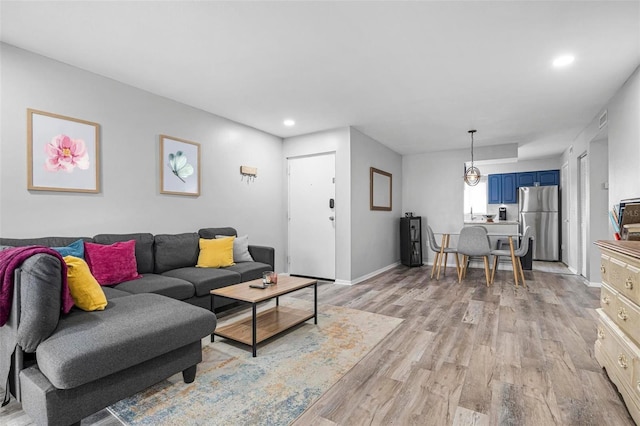 living room with light hardwood / wood-style floors