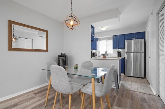 dining area with light hardwood / wood-style floors