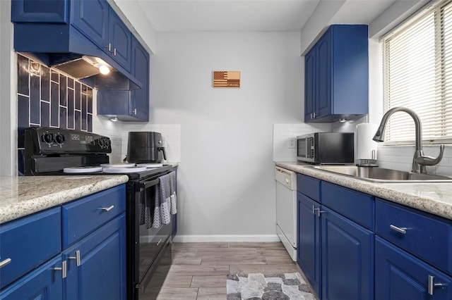 kitchen featuring sink, blue cabinets, backsplash, and black / electric stove