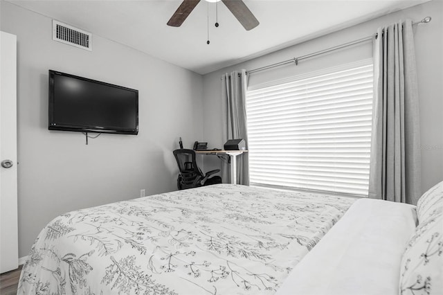 bedroom with ceiling fan and hardwood / wood-style floors